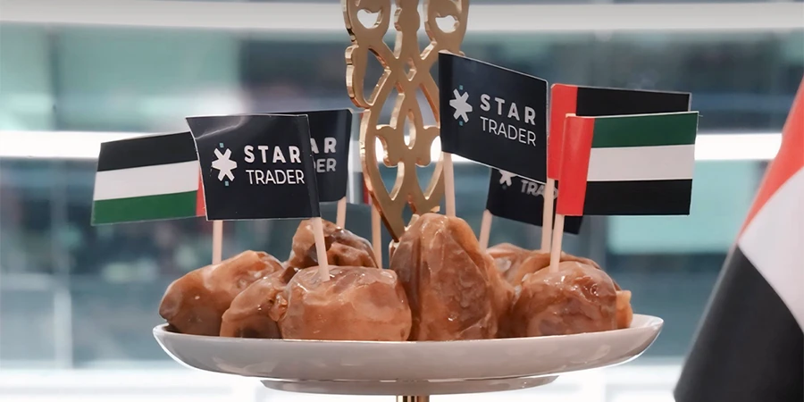 UAE National Day sweets with STARTRADER and UAE flags in office